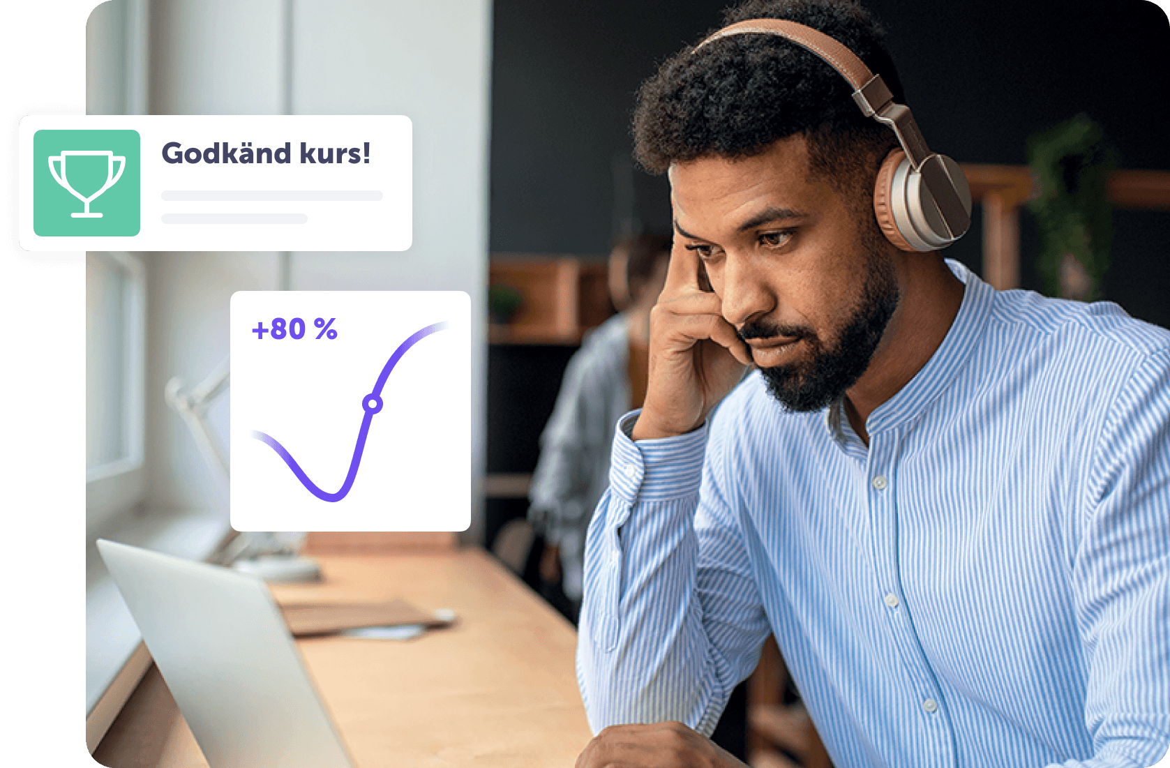 Man med hörlurar fokuserar på en dator med statistik och en kursbelöning.