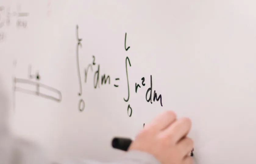 Make STEM accessible with LaTeX and ReadSpeaker - Person writing on white board.