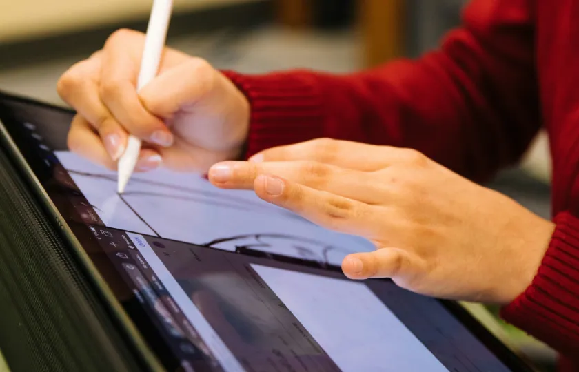 Making STEM accessible: person in red long sleeve shirt holding white pen