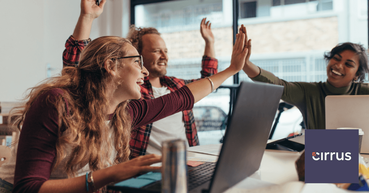 Happy colleagues high-five each other.