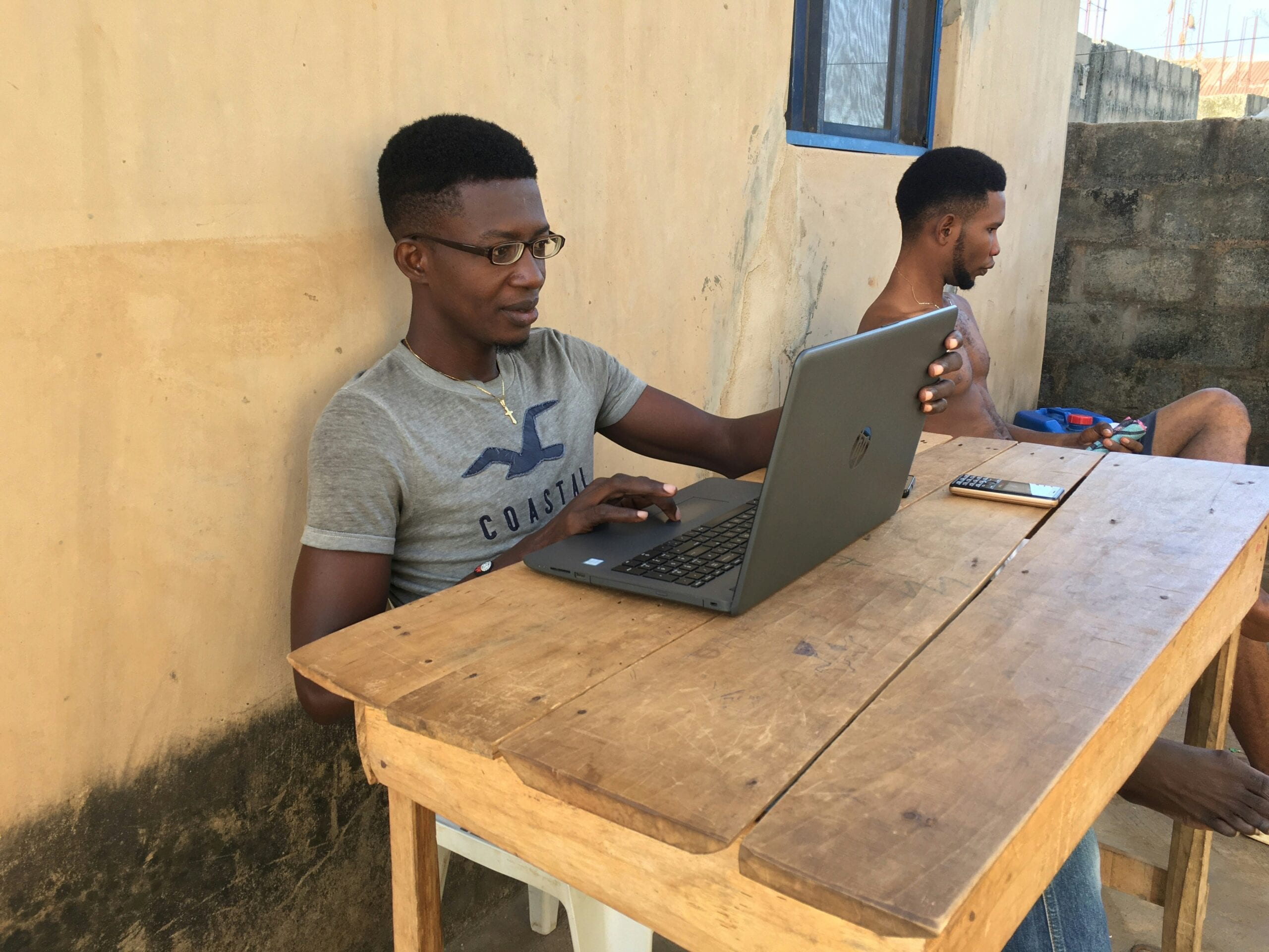 A man uses a laptop.